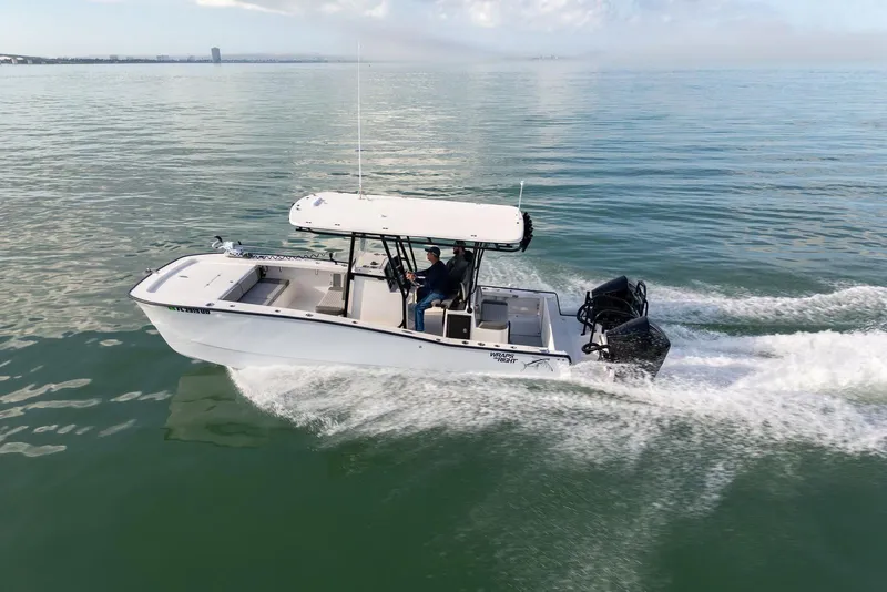 Slide: The Image of 2026 Calcutta 263 boat cruising on calm water, showcasing sleek design and powerful engine. - 13