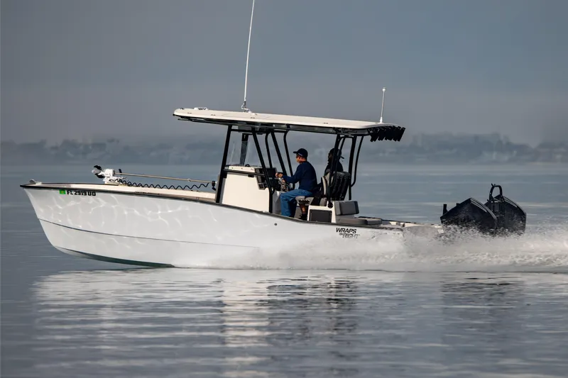 Slide: The Image of 2026 Calcutta 263 boat cruising on calm waters with two passengers. - 16