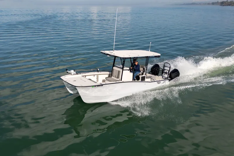 Slide: The Image of 2026 Calcutta 263 boat cruising on calm waters with a person steering. - 5