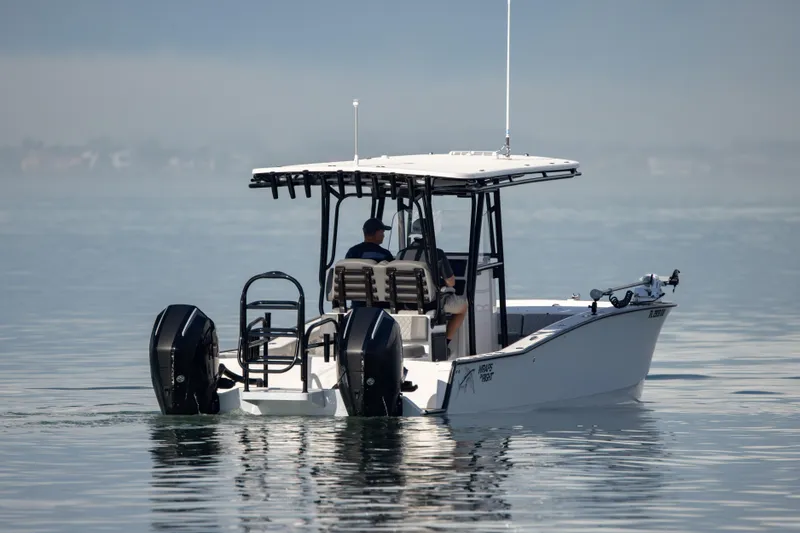 Slide: The Image of 2026 Calcutta 263 boat on calm water with two outboard motors. - 8