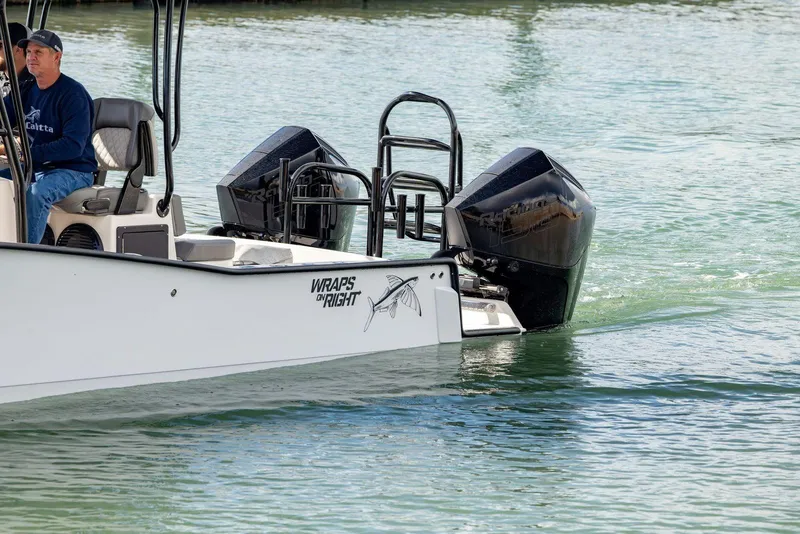 Slide: The Image of Calcutta 263 boat from 2026 with dual engines on water. - 9