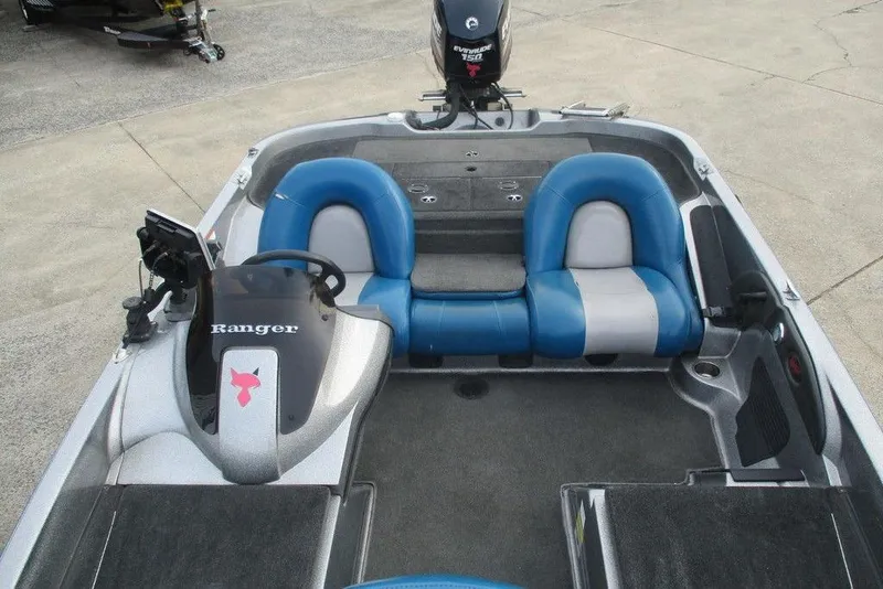 Slide: The Image of 2007 Ranger 188VS Intracoastal boat interior with blue seats and steering console. - 4