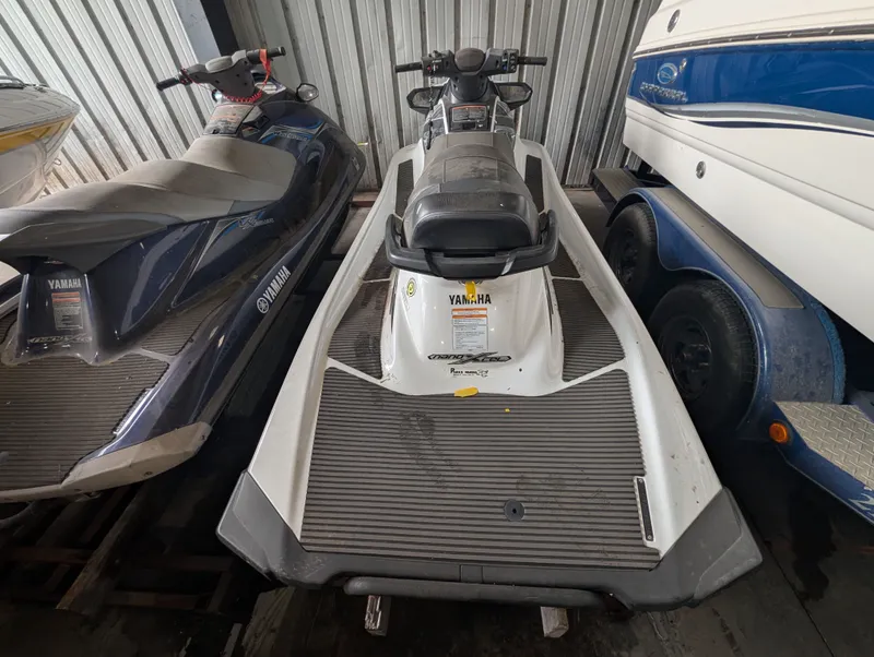 Slide: The Image of 2016 Yamaha VX1050A-RB jet ski in storage, parked between boats. - 4