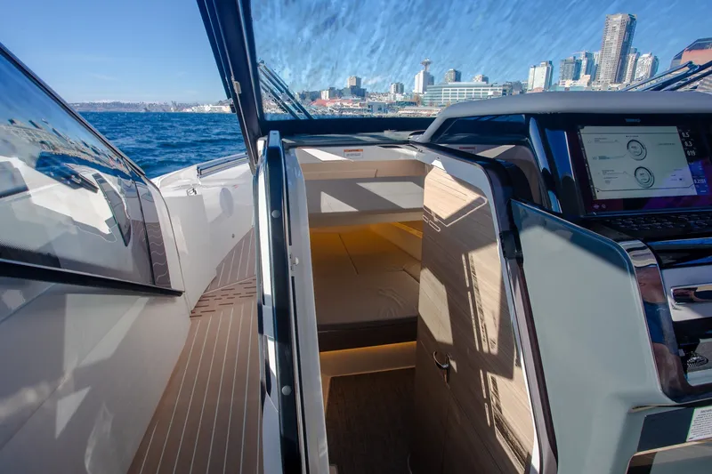 Slide: The Image of 2026 Saxdor 400 GTC yacht interior with city skyline and ocean view. - 30