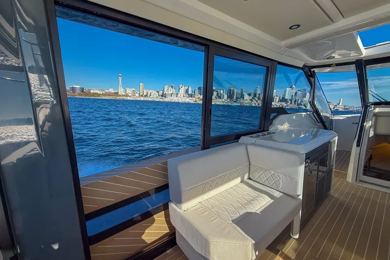 Slide: The Image of Interior view of 2026 Saxdor 400 GTC yacht with city skyline through windows. - 36