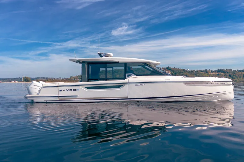 The Image of Saxdor 400 GTC 2026 boat on calm water under a clear blue sky. - 0