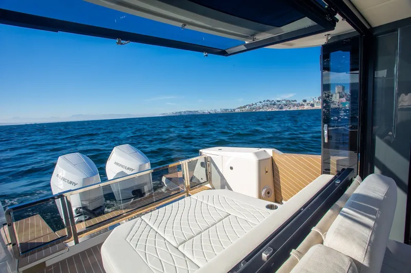 Slide: The Image of Luxurious 2026 Saxdor 400 GTC yacht interior with ocean view and twin Mercury engines. - 21
