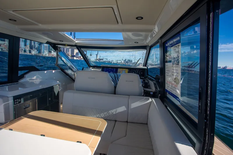 Slide: The Image of Interior of 2026 Saxdor 400 GTC yacht with modern seating and ocean view. - 23