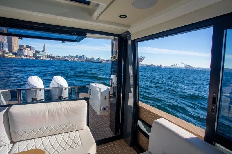 Slide: The Image of Interior view of 2026 Saxdor 400 GTC yacht with ocean and city skyline. - 27