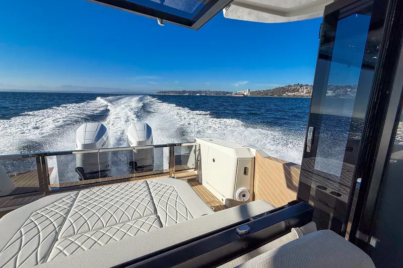 Slide: The Image of 2026 Saxdor 400 GTC cruising on open water, showcasing powerful dual engines and luxurious seating. - 34