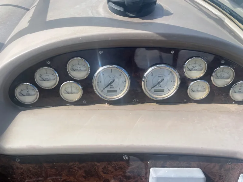 Slide: The Image of Dashboard of a 2005 Regal 3560 Express boat with gauges. - 10
