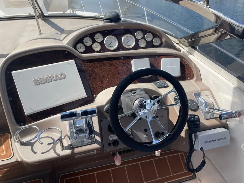 Slide: The Image of Helm of a 2005 Regal 3560 Express boat with Simrad navigation. - 13