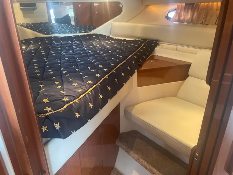 Slide: The Image of Interior of 2005 Regal 3560 Express with bed and seating area. - 16