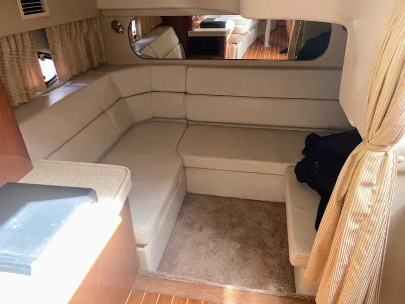 Slide: The Image of Interior of 2005 Regal 3560 Express with beige sofa and carpet. - 23