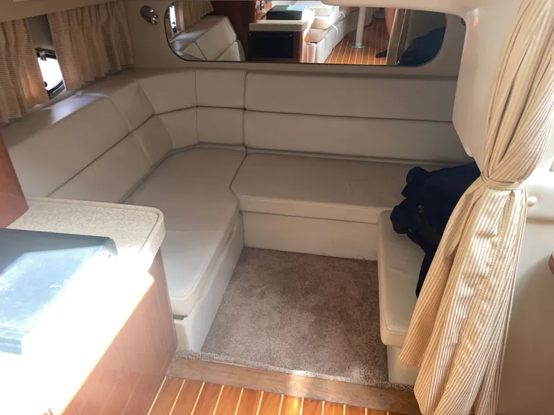 Slide: The Image of Interior of a 2005 Regal 3560 Express yacht with beige sofa. - 24