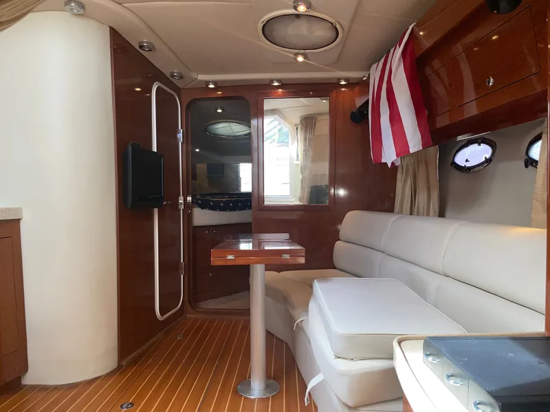 Slide: The Image of Interior of a 2005 Regal 3560 Express yacht with elegant furnishings. - 25