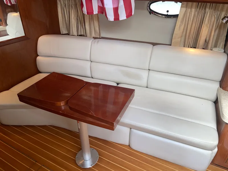 Slide: The Image of Interior of a 2005 Regal 3560 Express yacht with leather sofa. - 27