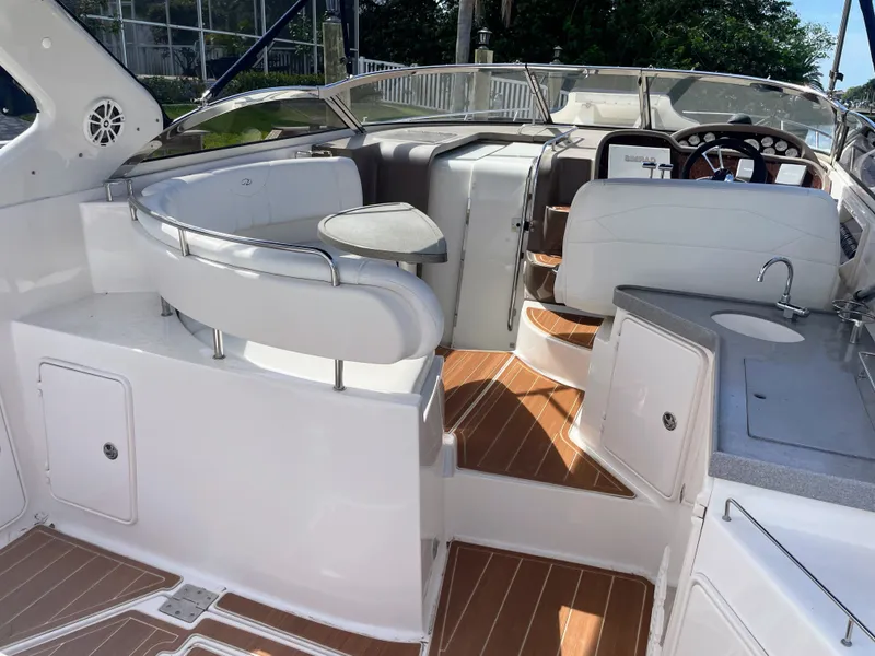 Slide: The Image of Interior of a 2005 Regal 3560 Express yacht with seating area and helm. - 32