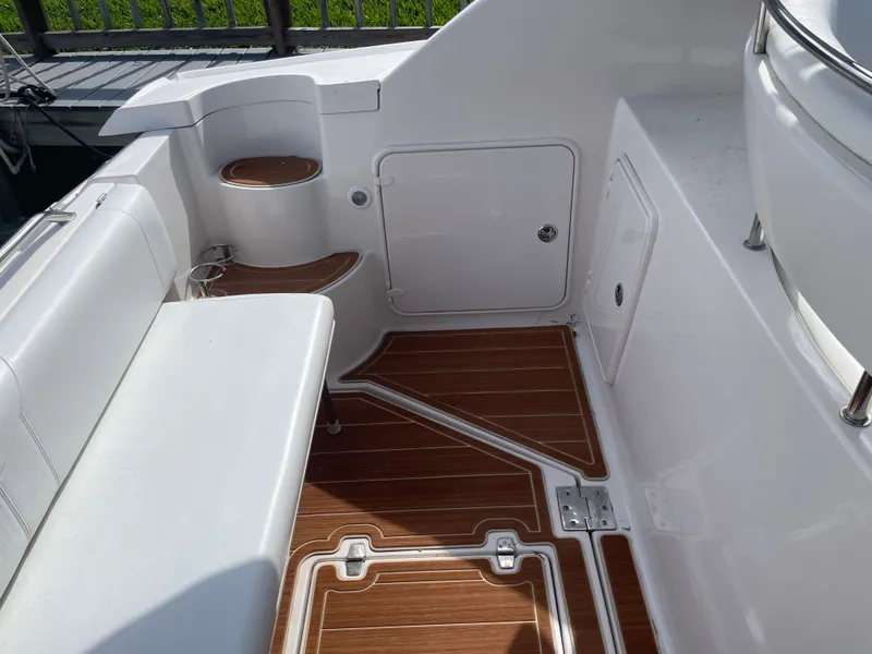 Slide: The Image of Interior of a 2005 Regal 3560 Express boat with wooden flooring. - 34