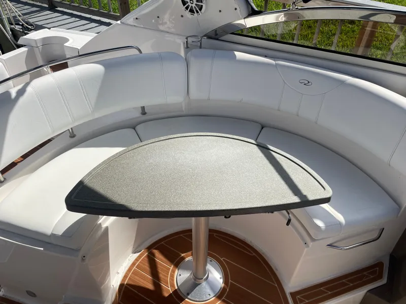 Slide: The Image of Interior of a 2005 Regal 3560 Express boat with seating area. - 40