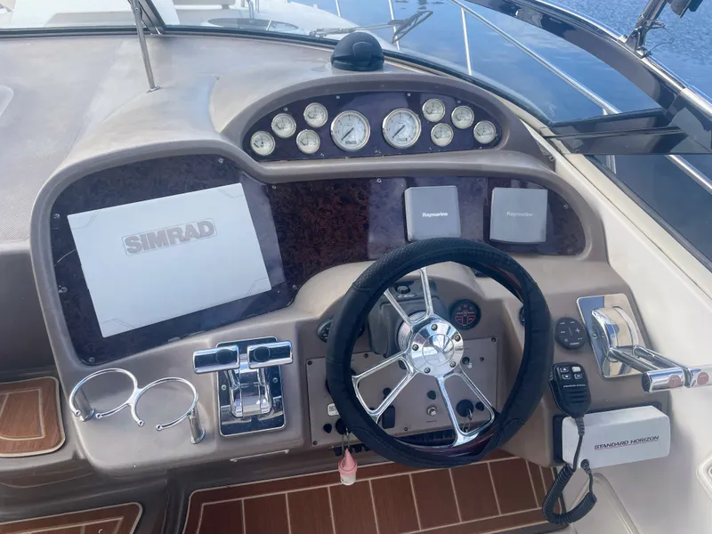 Slide: The Image of Helm console of a 2005 Regal 3560 Express boat. - 5