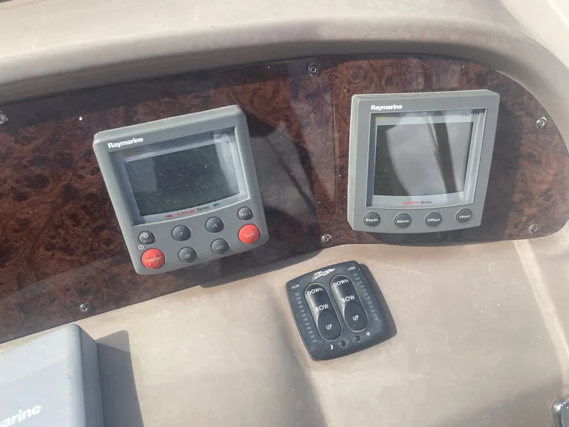 Slide: The Image of 2005 Regal 3560 Express boat controls with Raymarine devices. - 9