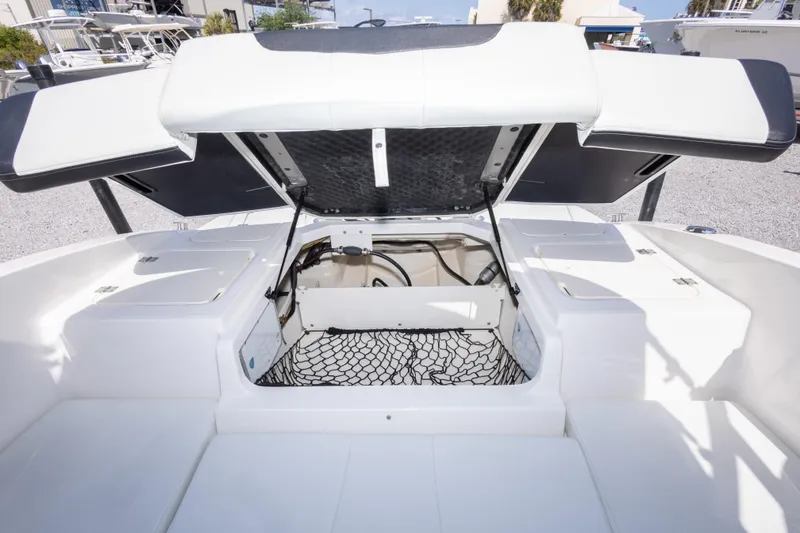 Slide: The Image of 2017 Chaparral 21 H2O Sport boat interior with open storage compartments. - 19