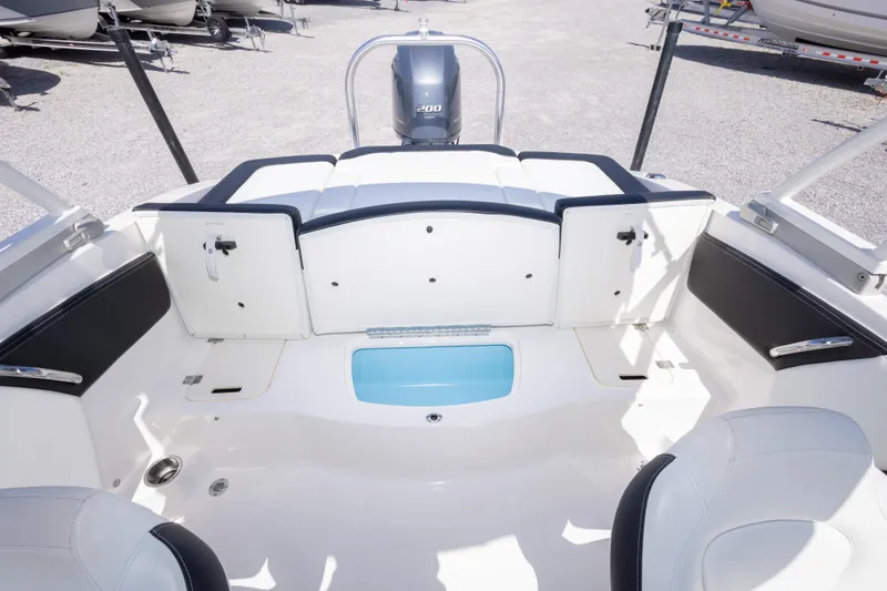Slide: The Image of 2017 Chaparral 21 H2O Sport boat interior with seating and storage compartments. - 22