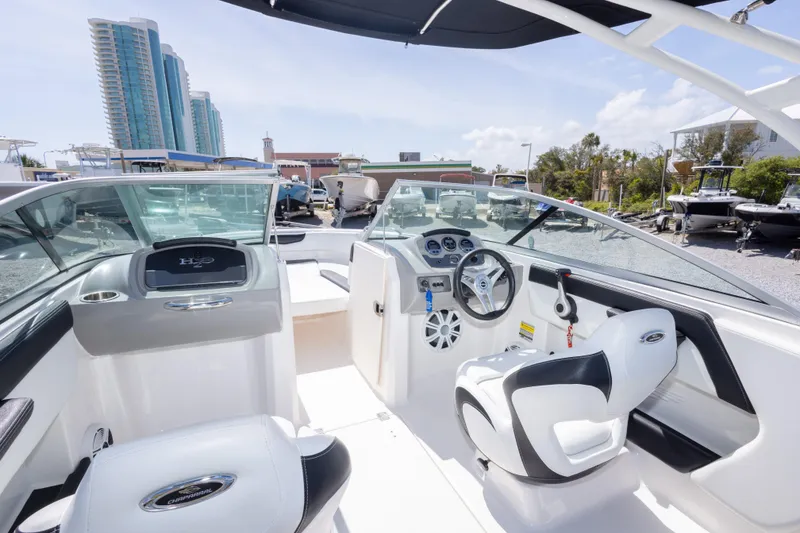 Slide: The Image of 2017 Chaparral 21 H2O Sport boat interior with modern dashboard and seating. - 33
