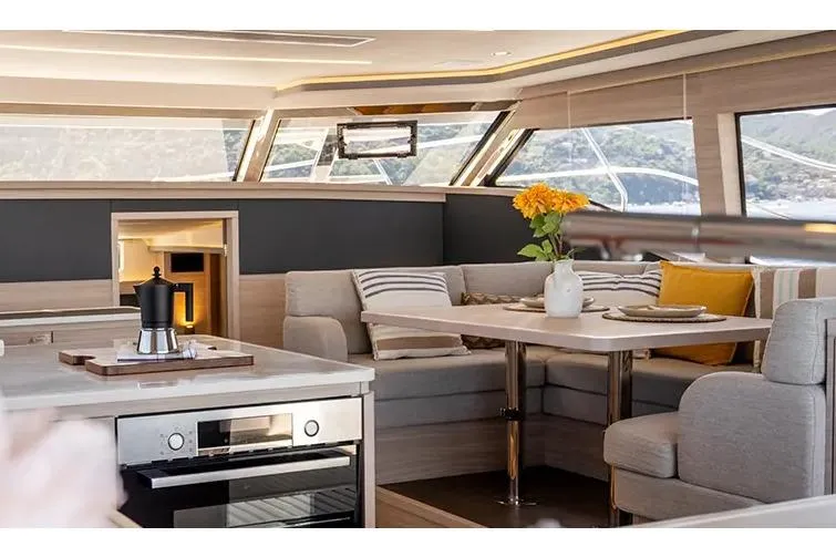 Slide: The Image of Manufacturer Provided Image: Luxurious interior of 2025 Aquila 46 Yacht with modern kitchen and cozy seating area. - 5