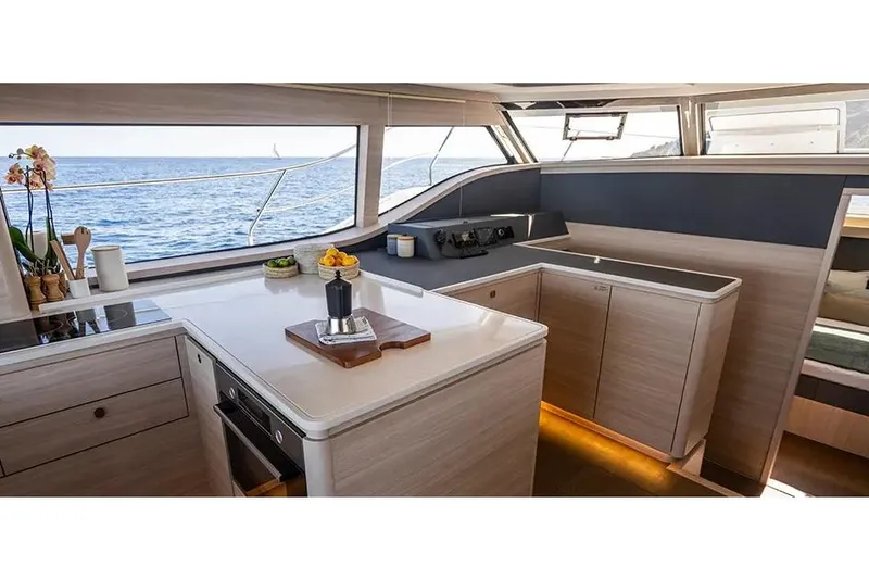 Slide: The Image of Manufacturer Provided Image: Luxurious interior of 2025 Aquila 46 Yacht with modern kitchen and ocean view. - 6