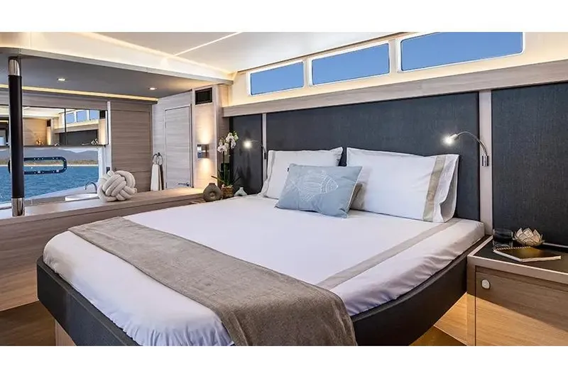 Slide: The Image of Manufacturer Provided Image: Luxurious bedroom interior of 2025 Aquila 46 Yacht with modern design and ocean view. - 7
