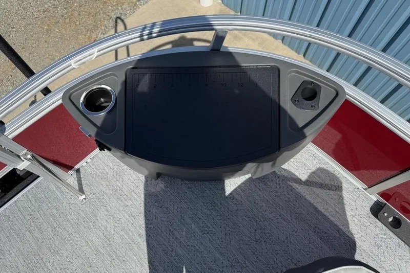 Slide: The Image of 2026 Sun Tracker Bass Buggy 18 DLX boat deck with cup holder and measuring board. - 10