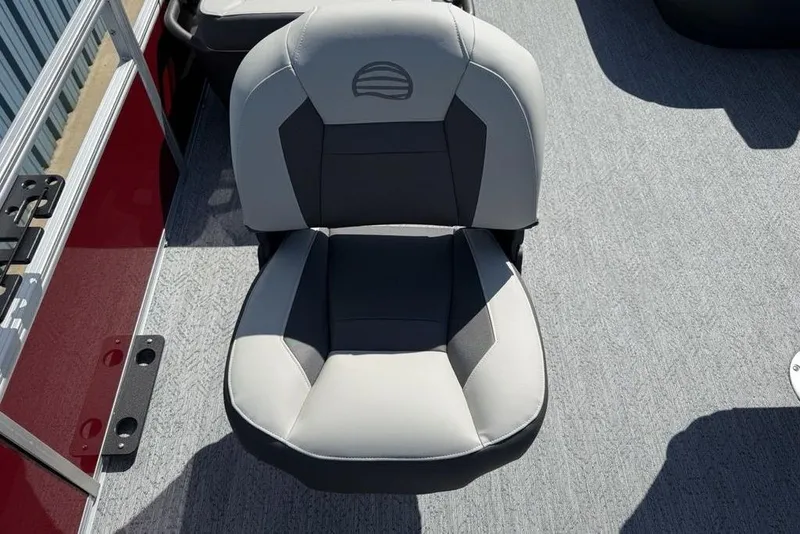 Slide: The Image of 2026 Sun Tracker Bass Buggy 18 DLX boat seat, gray and black upholstery, on deck. - 12