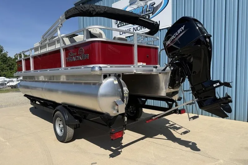 Slide: The Image of 2026 Sun Tracker Bass Buggy 18 DLX pontoon boat with Mercury outboard motor on trailer. - 14