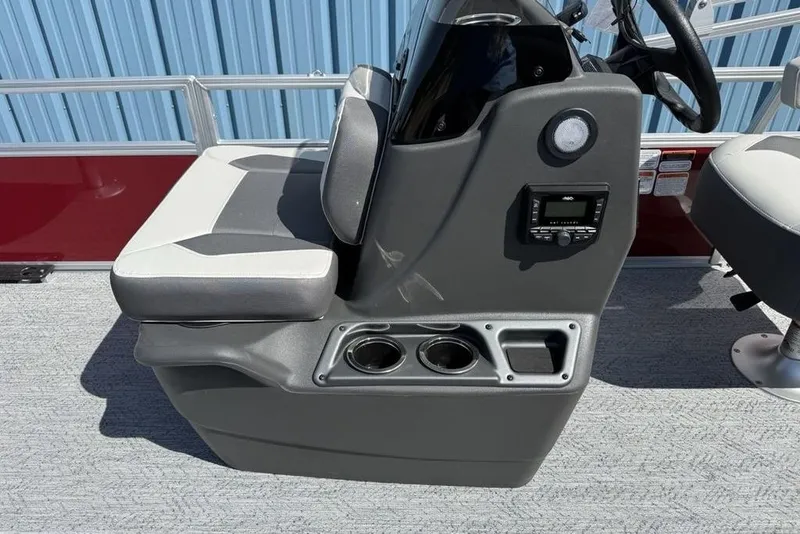 Slide: The Image of 2026 Sun Tracker Bass Buggy 18 DLX boat console with seating and cup holders. - 18