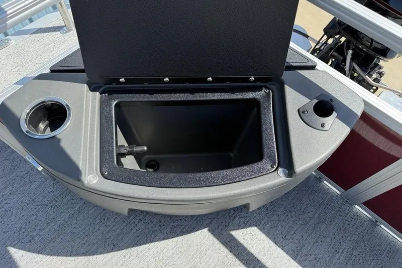 Slide: The Image of Open storage compartment on 2026 Sun Tracker Bass Buggy 18 DLX boat deck. - 19