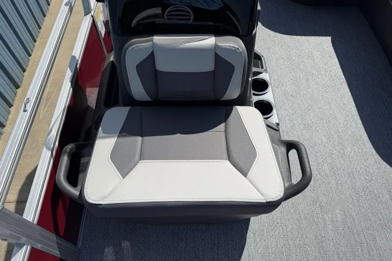 Slide: The Image of 2026 Sun Tracker Bass Buggy 18 DLX boat seat with cup holders and modern design. - 24