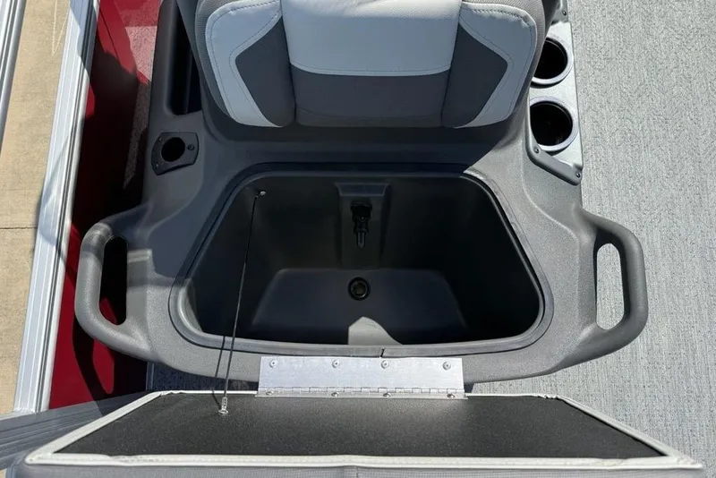 Slide: The Image of Storage compartment on 2026 Sun Tracker Bass Buggy 18 DLX boat with cup holders. - 25