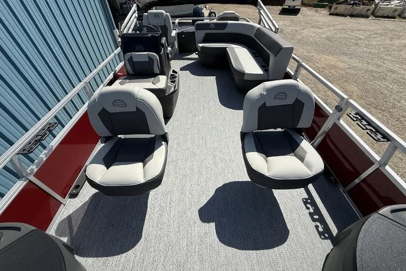 Slide: The Image of 2026 Sun Tracker Bass Buggy 18 DLX pontoon boat with spacious seating and modern design. - 26