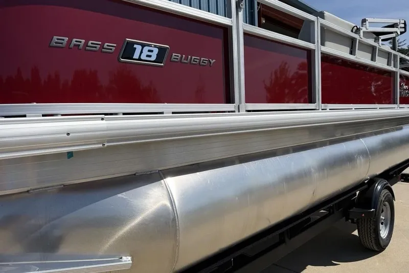 Slide: The Image of 2026 Sun Tracker Bass Buggy 18 DLX pontoon boat with red and silver design. - 4