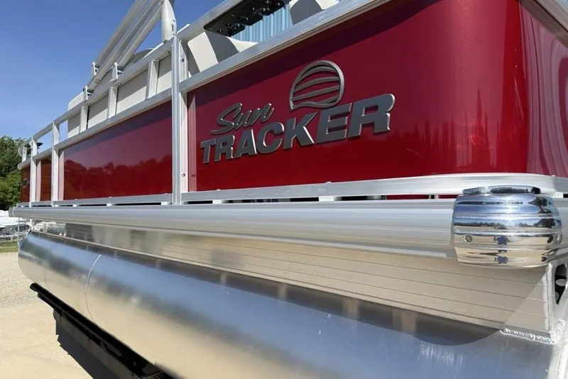 Slide: The Image of 2026 Sun Tracker Bass Buggy 18 DLX pontoon boat with sleek red and silver design. - 5