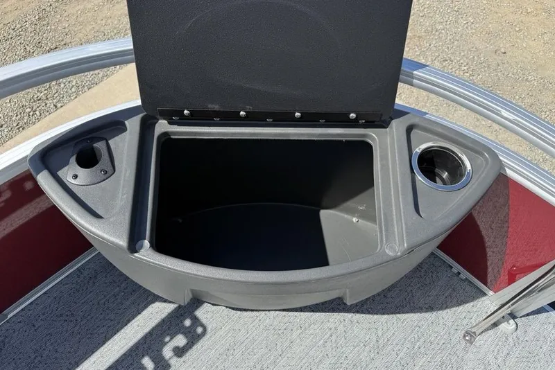 Slide: The Image of Storage compartment on 2026 Sun Tracker Bass Buggy 18 DLX pontoon boat, featuring cup holders. - 7