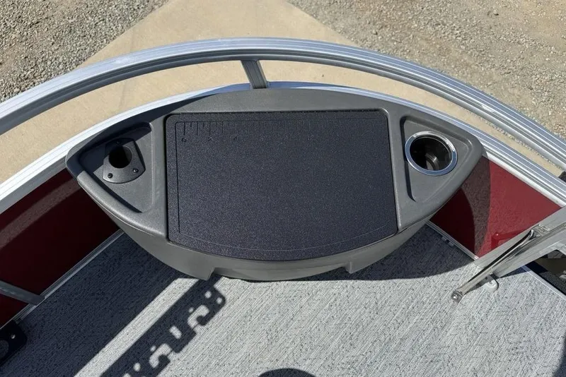 Slide: The Image of 2026 Sun Tracker Bass Buggy 18 DLX boat console with cup holders and storage. - 9