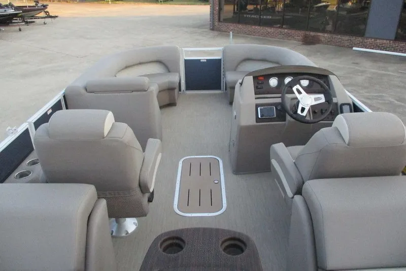 Slide: The Image of 2018 Bennington 22SSRXP pontoon boat interior with helm and seating area. - 10
