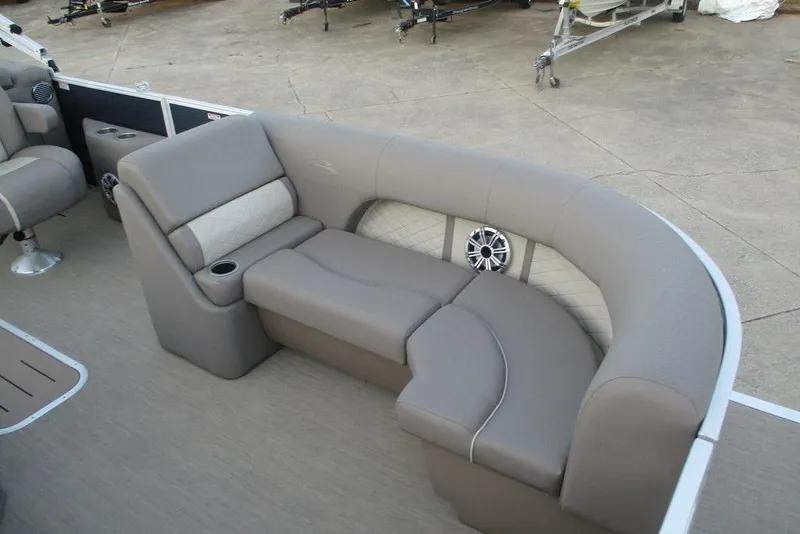 Slide: The Image of 2018 Bennington 22SSRXP boat interior with plush seating and integrated speaker system. - 3