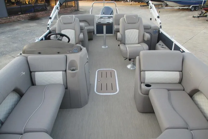 Slide: The Image of 2018 Bennington 22SSRXP pontoon boat interior with plush seating and modern design. - 4