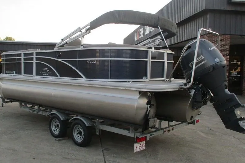 Slide: The Image of 2018 Bennington 22SSRXP pontoon boat on trailer with Yamaha outboard motor. - 5