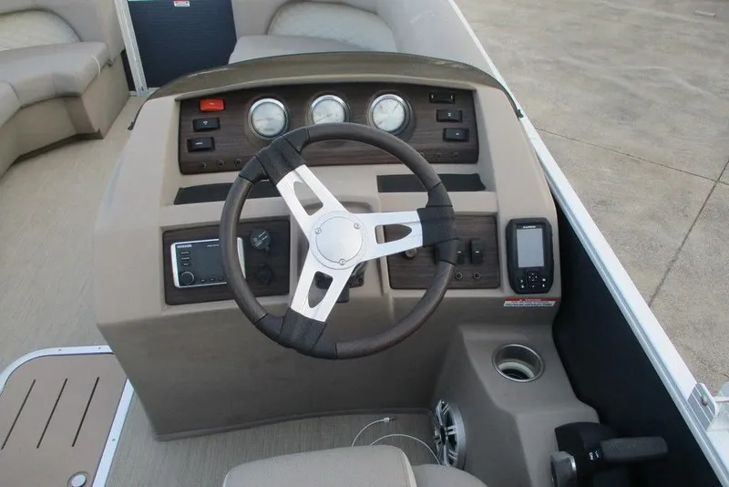 Slide: The Image of Steering console of a 2018 Bennington 22SSRXP boat with gauges and controls. - 9