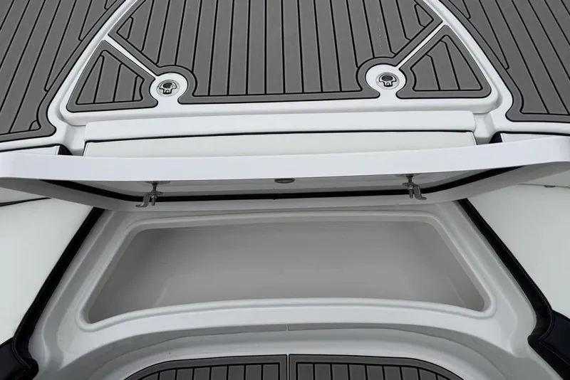 Slide: The Image of 2026 Tidewater 2500 Carolina Bay boat storage compartment with open hatch and sleek design. - 18